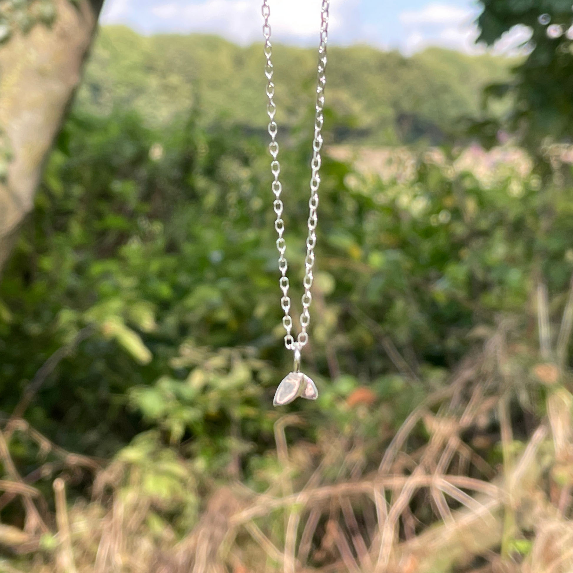Duo leaf bracelet hanging with a nature background