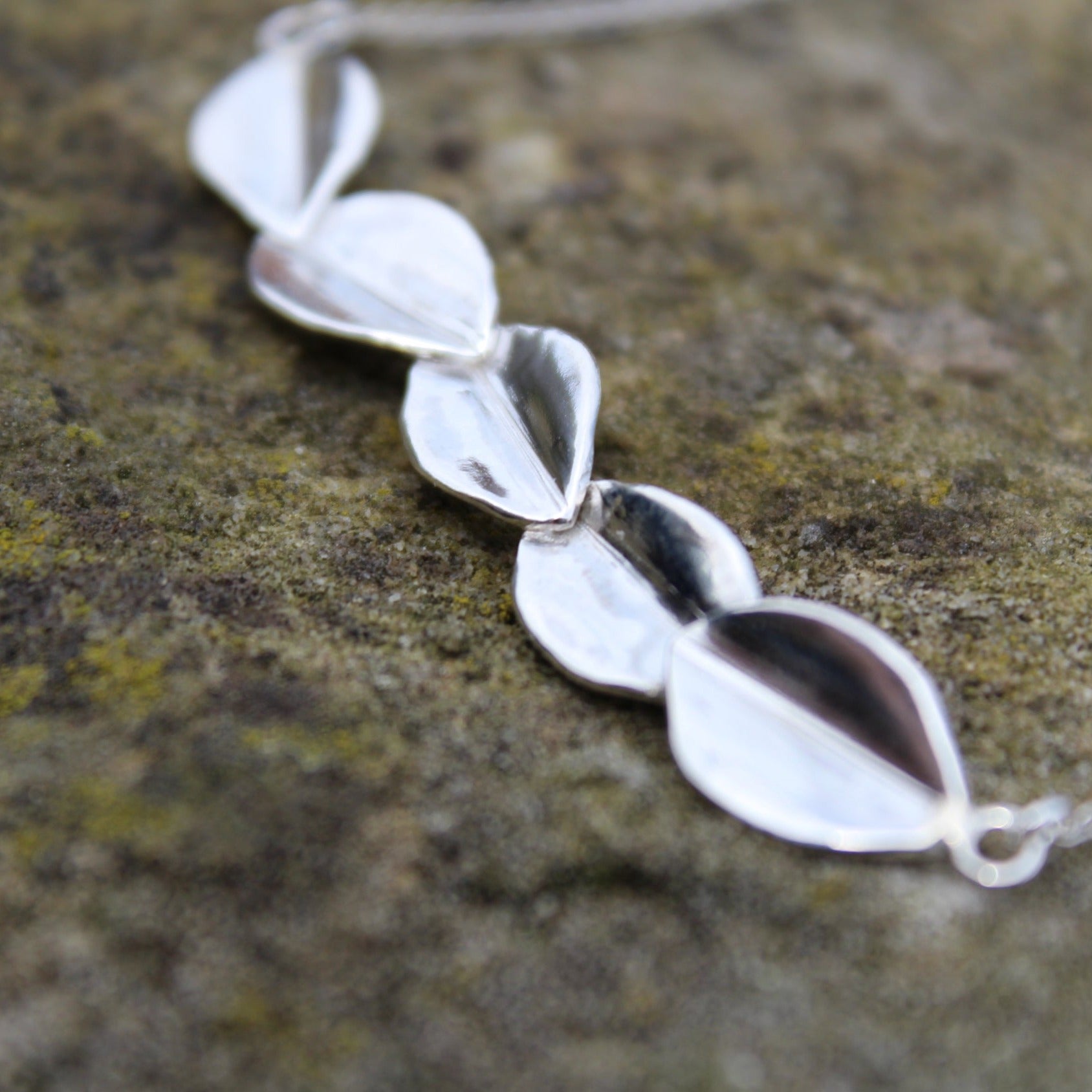 Close up of leaves on Scatter five leaf sterling silver necklace. Handmade by Jen Lithgo Jewellery Designer