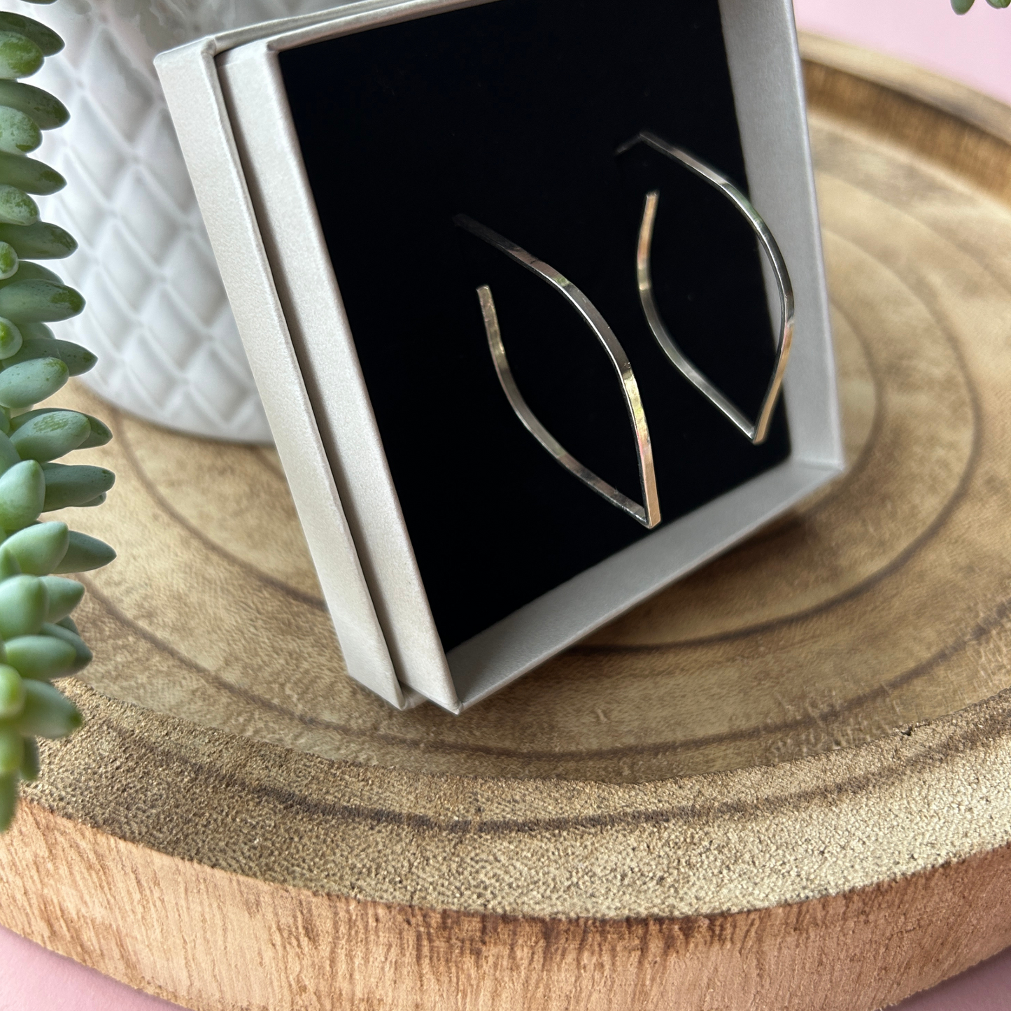 Handmade Sterling Silver Leaf silhouette outline Hoop studs displayed in a branded box made by Jen Lithgo Jewellery Designer