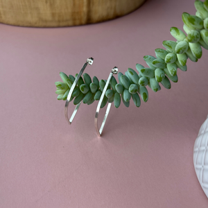 Sterling Silver Outline Lead Stud Hoops hanging on a succulent - by Jen Lithgo Jewellery