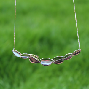 bridesmaid 7 leaf necklace with grass background