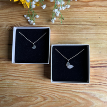 Load image into Gallery viewer, duo leaf necklaces in two sizes in ivory boxes with black insert on a wooden table top