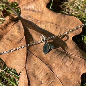 Duo leaf bracelet close up on a brown leaf