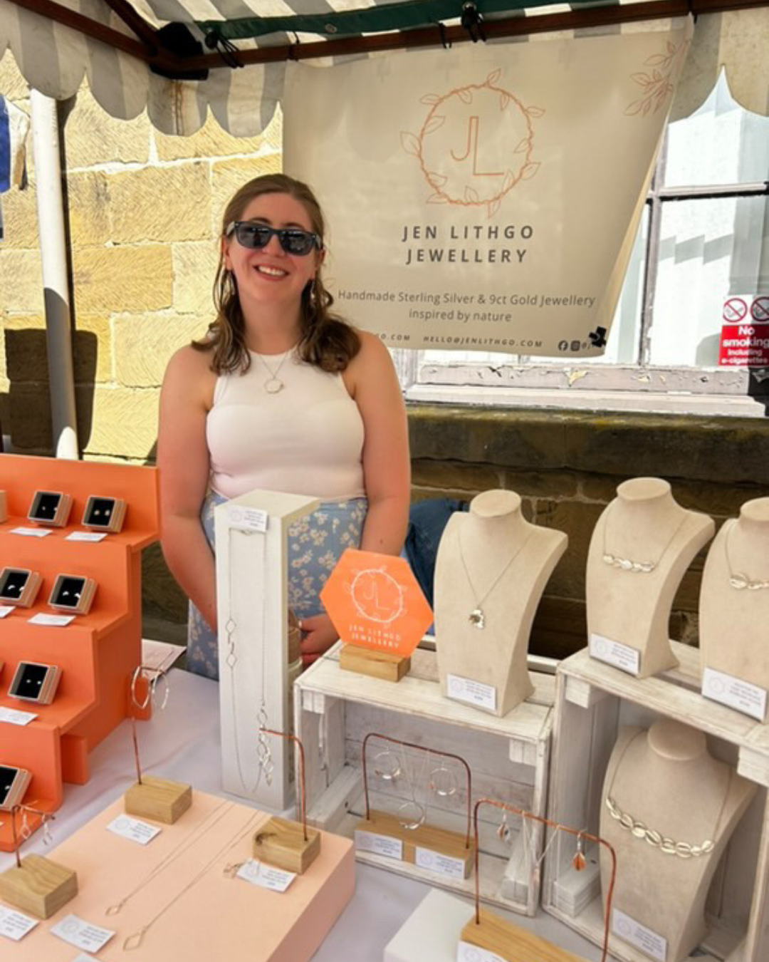 Jen Lithgo stood behind stall set up with Jen Lithgo Jewellery branding